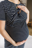 Navy and white striped maternity dress with cinched waist and nursing/breastfeeding panel